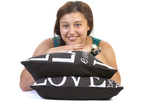 teenage girl laying over pillow on white background
