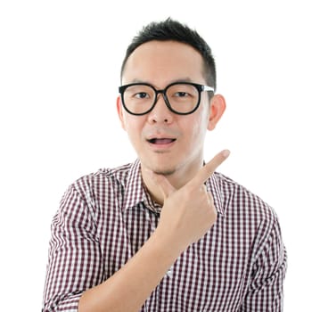 Portrait of Asian man shocked and looking at camera isolated on white background.
