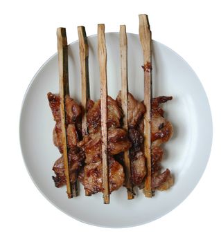 Traditional Thai roasted pork on gray dish ,isolate white background top view.
