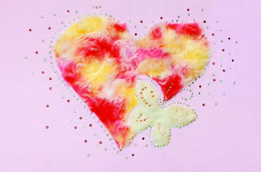 Heart butterfly fluff and sequin, Decoration on a pink fabric background