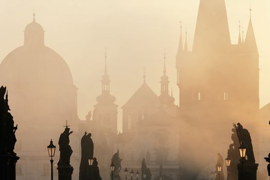 czech republic prague - charles bridge on foogy morning