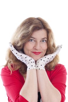 portrait of a middle-aged woman in red with polka-dot gloves - isolated on white