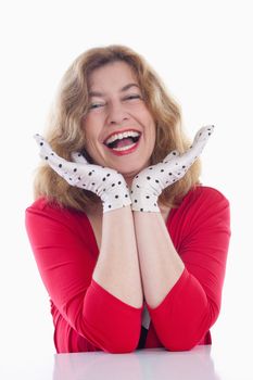 portrait of a middle-aged woman in red with polka-dot gloves - isolated on white