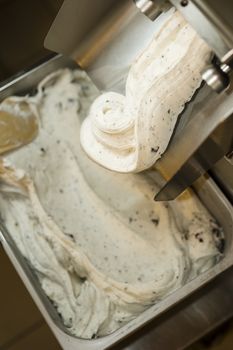 Ice cream preparation with different tools, ingredients, and machines
