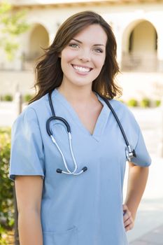 Proud Attractive Young Adult Woman Doctor or Nurse Portrait Outside.