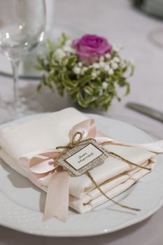 Ceremony silverware and decoration on elegant table
