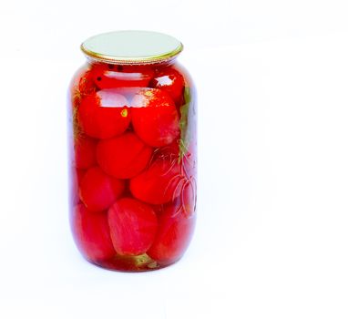 Glass bottle with red ripe canned tomatoes, which are sealed by a metal cover. Presented on a white background.