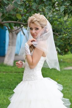 The young beautiful wife in the wedding day