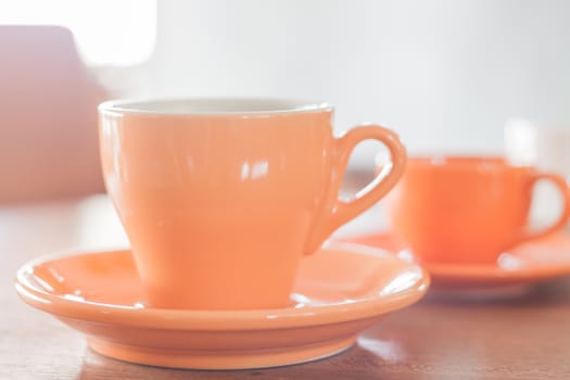 Orange coffee cup and mini orange coffee cup, stock photo