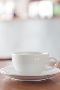 White mug on wooden table, stock photo