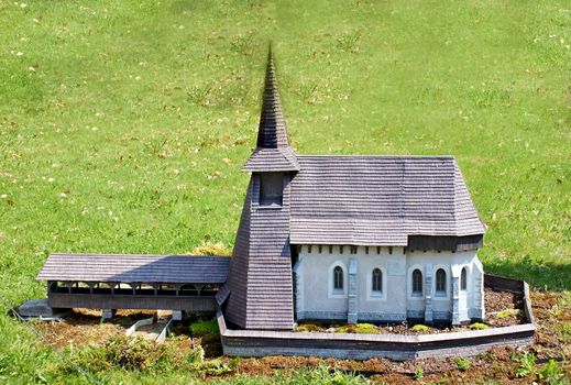 Photo shows closeup of an old house in the middle of the nature.