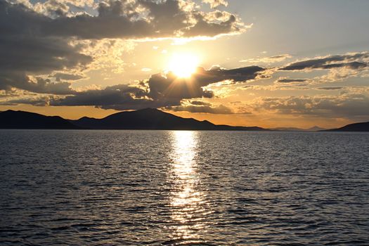 Photo shows Greek sunset over the sea.