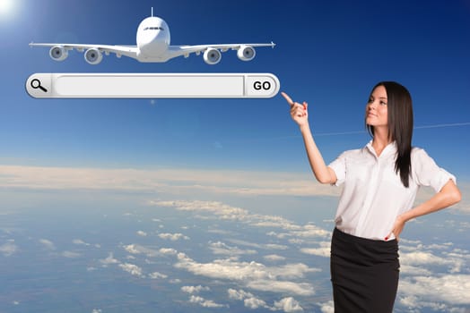 Businesswoman pointing her finger in search string. Passenger airplane in sky as backdrop