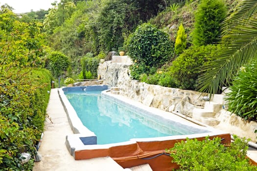 Outdoor swimming pool in nature