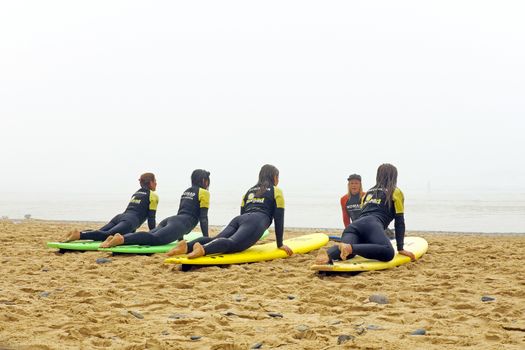 VALE FIGUEIRAS, PORTUGAL - August 9 2014:  Surfers getting surfers lessons on the famous surfers beach Vale Figueiras in Portugal