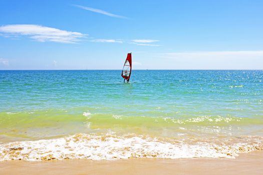 Surfer at the ocean in the Algarve Portugal