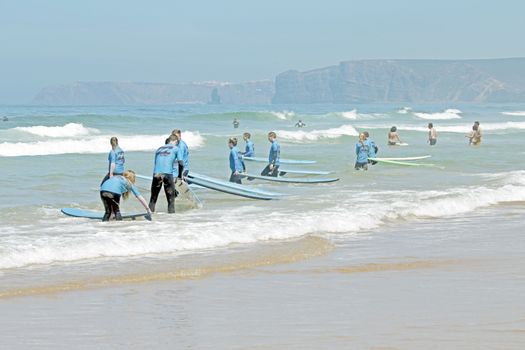 VALE FIGUEIRAS, PORTUGAL - August 20 2014:  Surfers getting surf classes on the famous surfers beach Vale Figueiras in Portugal