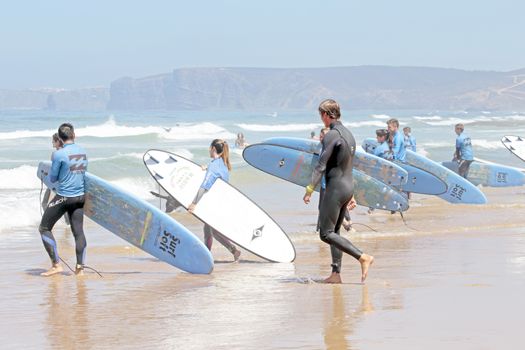 VALE FIGUEIRAS, PORTUGAL - August 20 2014:  Surfers getting surf classes on the famous surfers beach Vale Figueiras in Portugal