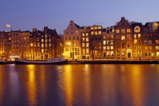 Amsterdam by night in the Netherlands at the Amstel