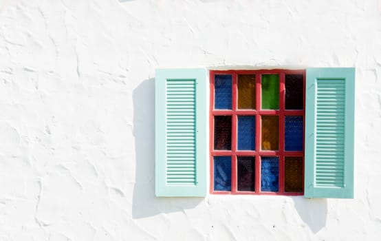 vintage open windows on white cement wall