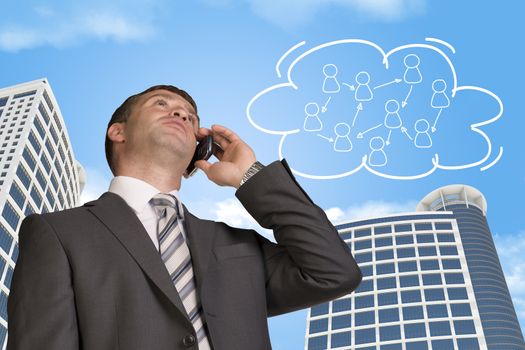 Businessman talking on the phone. Skyscrapers and cloud with people icons in background