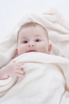 portrait of sweet little baby girl with a blanket - isolated on white