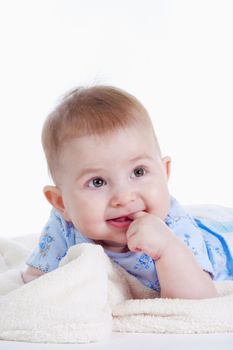 portrait of sweet little baby girl with a blanket - isolated on white