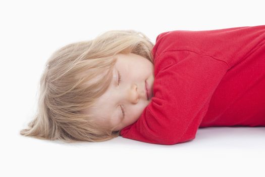 boy with long blond hair lying down sleeping - isolated on white