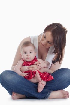 portrait of mother with her little baby girl -isolated on white