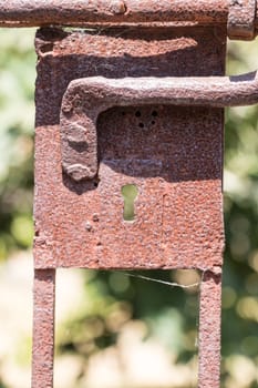 rusty lock in a green field a