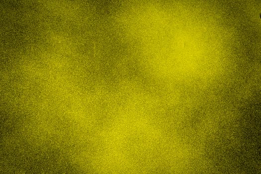 Yellow dark texture background with bright center spotlight