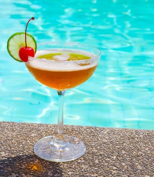 Cocktails near the swimming pool on summer .