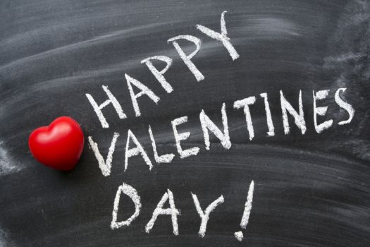 happy valentine's day phrase handwritten on blackboard