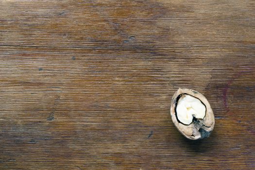 vintage wooden background with half-walnut on it