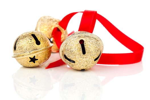 Christmas jingle bell with red ribbon, on white