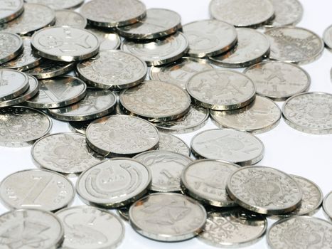 Bunch of Latvian lat coins on white background