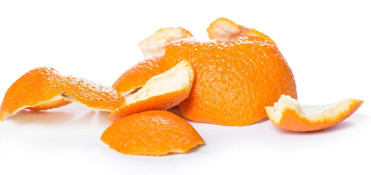 Orange being peeled with its skin around