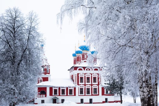 White church in winter in Uglich
