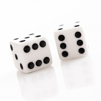 Rolling dice over a white background