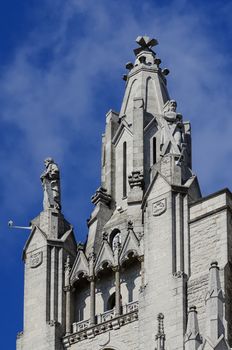 Details of a roof Tibidabo church on mountain in Barcelona with christ statue overviewing the city