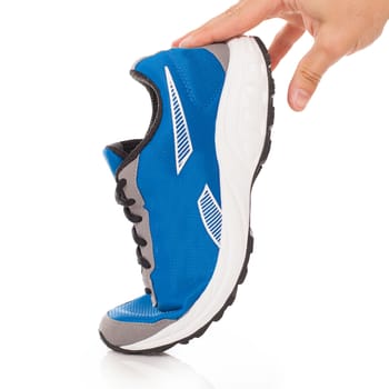 Picture of a pair of blue trainers over a white background