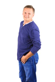 Casually dressed middle aged man smiling. 3/4 view of man shot in vertical format isolated on white.