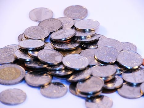 Bunch of Latvian lat coins on white background