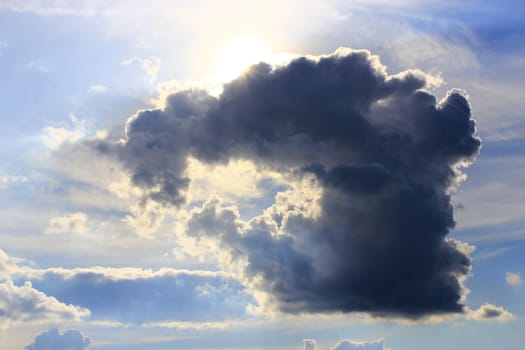 cloud with unusual shape and sunny beams