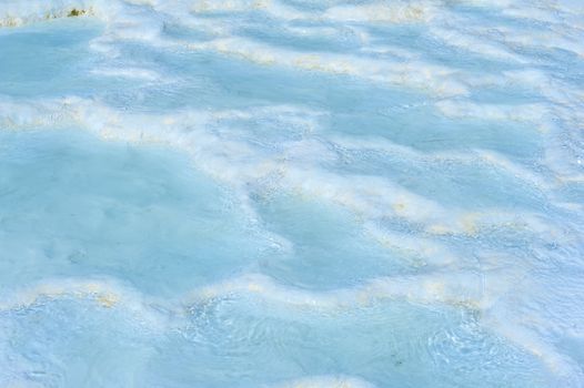 Blue pools and white travertine terraces at Pamukkale, Turkey 