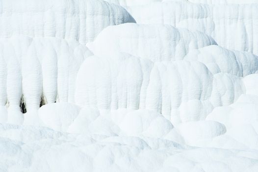 Pamukkale (cotton castle) natural wonder is created by a layers of white travertine looking like cotton, Turkey 