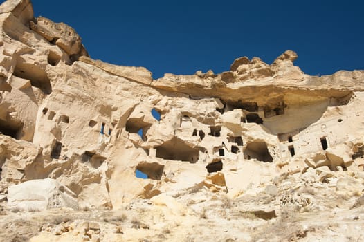 Detail of the ancient castle of Cavusin dug from a mountains, Cappadocia, Turkey
