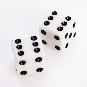 Rolling dice over a white background