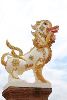 Lion in Buddhist religion have naga  in mouth.Siting at the entrance of temple.
