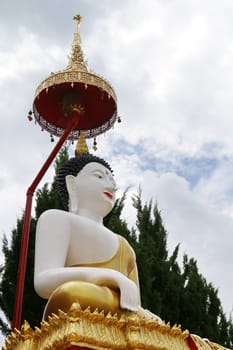 The image of Buddha which have Thai art umbrella over the head.